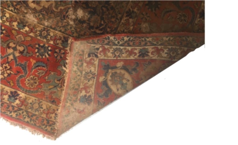 Isfahan-Teppich nach der Flutkatastrophe in Stolberg – verlaufene und blutende Farben nach Schlamm Entfernung sichtbar